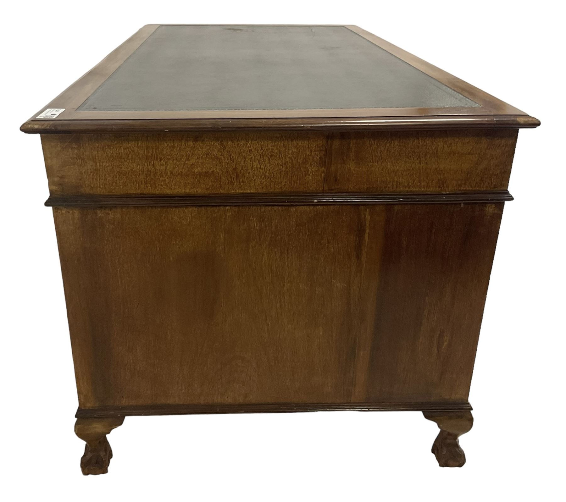 Georgian design twin pedestal desk, rectangular top with green leather inset, fitted with nine drawers, on cabriole supports with ball and claw feet 