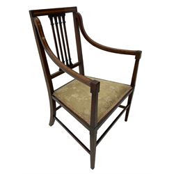 Edwardian satinwood inlaid mahogany elbow chair, the bar back over four vertical rails with foliate and scroll carved decoration, curved and down-swept arms, on square tapering supports united by stretchers 