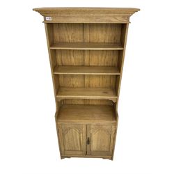 Contemporary light oak open bookcase, fitted with three shelves over double cupboard