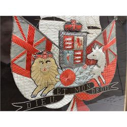 Early 20th century silk needlework panel, depicting a ship in full sail and Royal Coat of Arms to centre, with red and white ensigns to either side, lion and unicorn below with quote 'Dieu Et Mon Droit', upon a black silk ground within gilt frame, H59cm