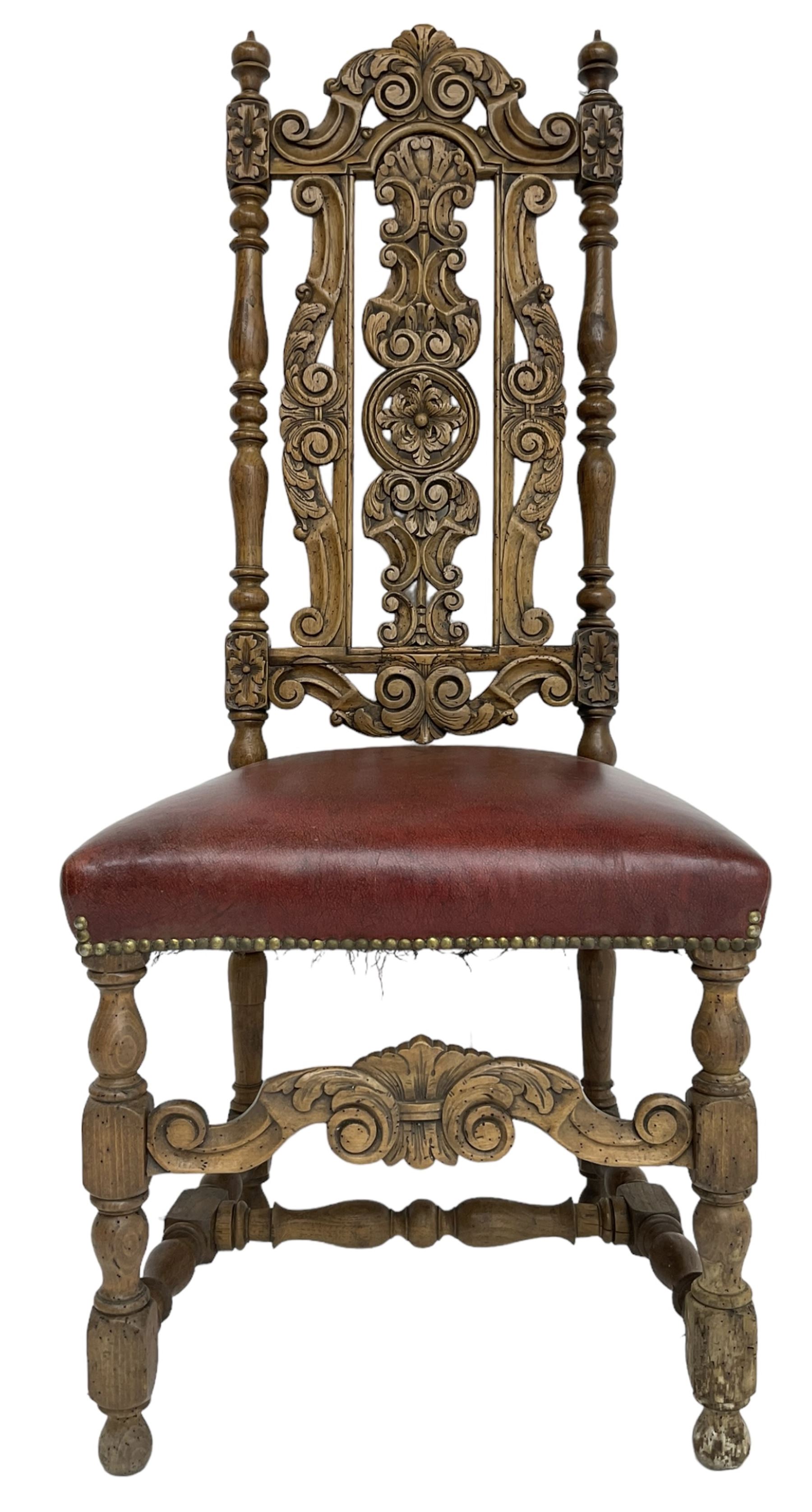 Carolean design oak high-back chair, the cresting rail carved with S-scrolls and foliage, the splat with a central flower head decorated with extending scrolls and acanthus leaves, upholstered seat, on turned and block supports united by S-scroll carved middle rail and turned stretchers