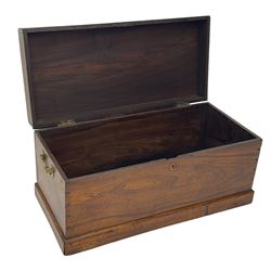 19th century teak blanket chest, hinged lid over plain front, fitted with brass carrying handles on plinth base 