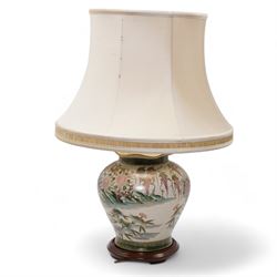 Oriental table lamp, of squat baluster form, decorated with ducks around a pond with bloss...