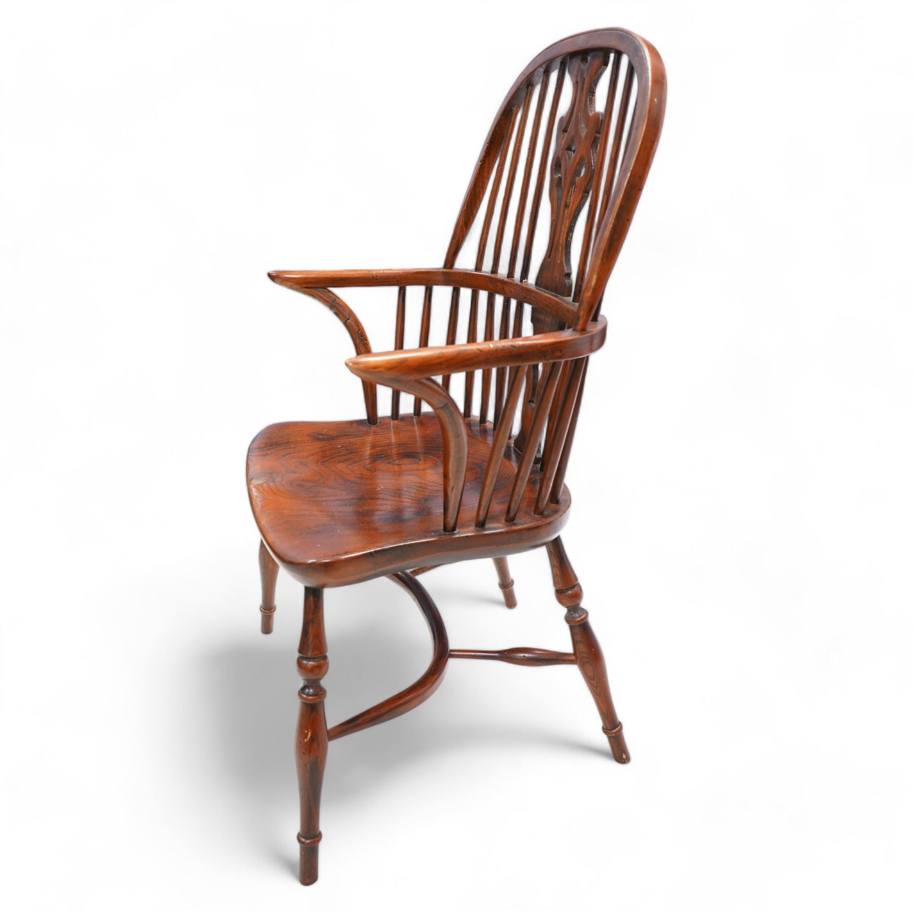 Ash and elm Windsor armchair, double hoop and stick back with shaped and pierced splat, dished saddle seat on turned supports united by crinoline stretcher 