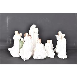 Eight Royal Doulton figures, including Fair Maiden, Across the Miles, Christmas Carols etc together with two Royal Worcester figures   