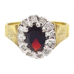 18ct gold oval cut garnet and diamond cluster ring, London 1975