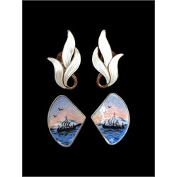 Two pairs of Scandinavian silver and enamel clip on earrings, including white leaf design pair