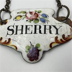 Two late 18th/early 19th century enamel wine labels, each of shaped form, titled 'CLARET', and 'SHERRY' and decorated with floral sprigs and scroll detail upon a white ground, each with suspension chain, each approximately H3.5cm W5cm