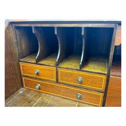 Mid-to-late 20th century inlaid mahogany bureau, inlaid floral medallion to the top, the fall front opening to reveal fitted interior with pigeonholes, small drawers and central cupboard, green inset writing surface with gilt tooling, four drawers below with brass handles, raised on shaped bracket feet