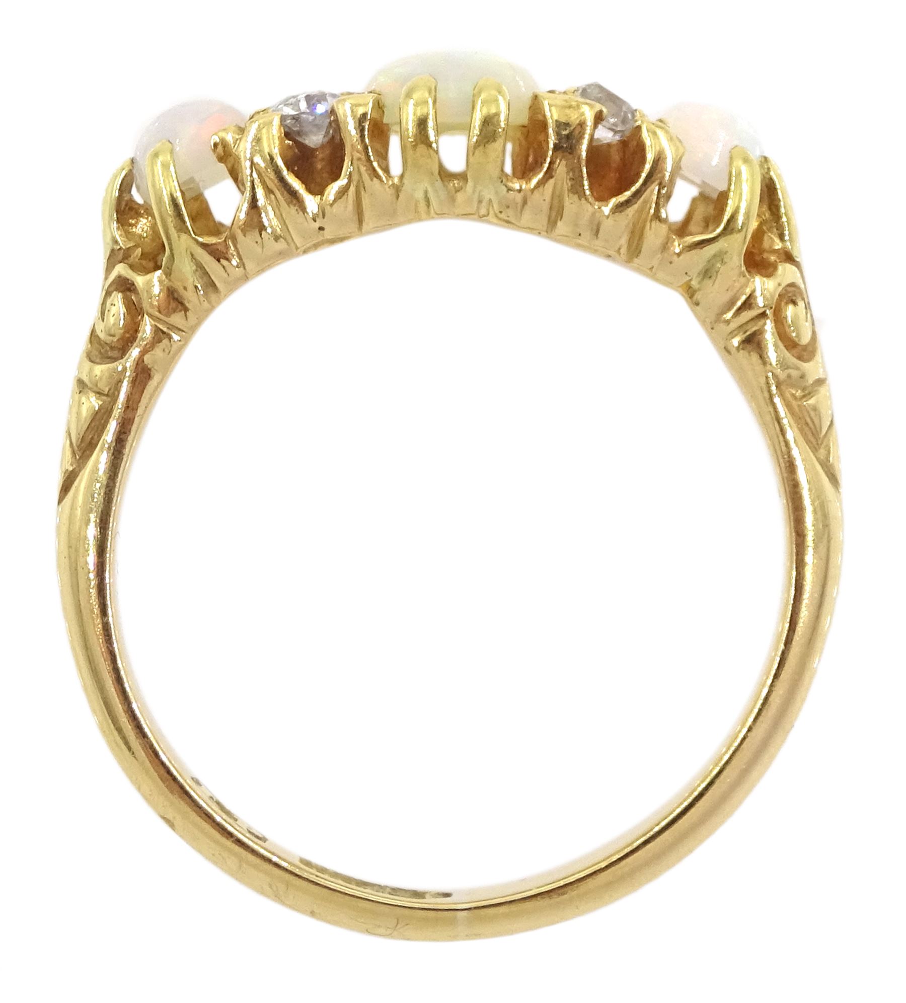 Early 20th century 18ct gold three stone opal and four stone old cut diamond ring, hallmarked