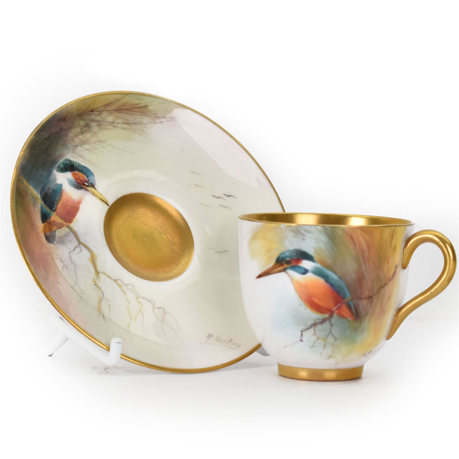 Royal Worcester cabinet cup, decorated with a kingfisher upon a branch by H. Powell, artist signed, together with matching saucer by other artist