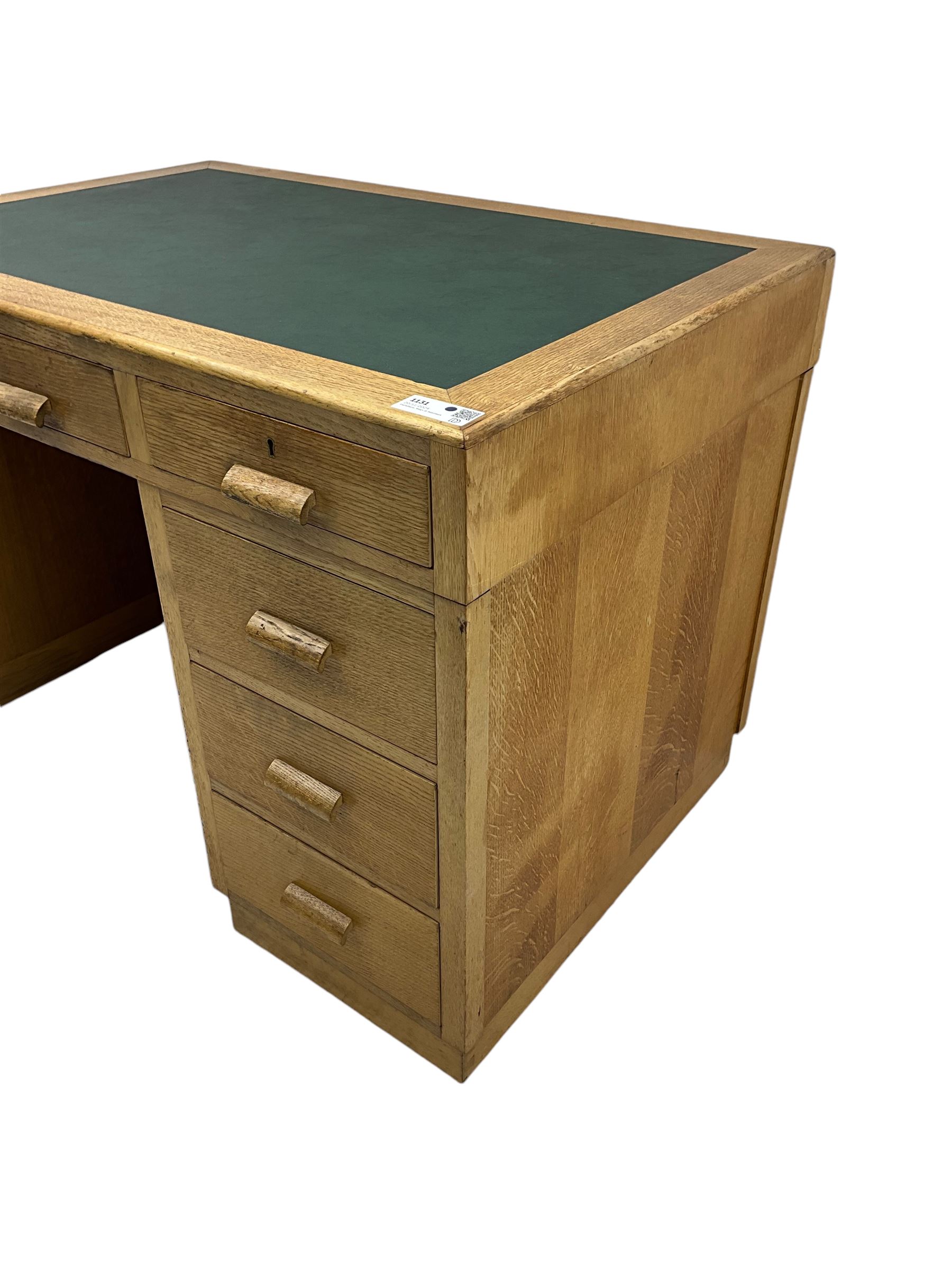 Early to mid-20th century oak pedestal desk, rectangular top with inset writing surface, fitted with five drawers 