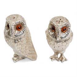 Pair of Elizabeth II silver owl salt and pepper casters with gilded interiors, the naturalistically cast bodies with glass eyes H7.5cm London 2006 Maker Comyns of London 