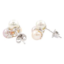 Pair of 18ct white gold three stone peach, pink and white pearl and round brilliant cut diamond cluster stud earrings, Edinburgh 2006