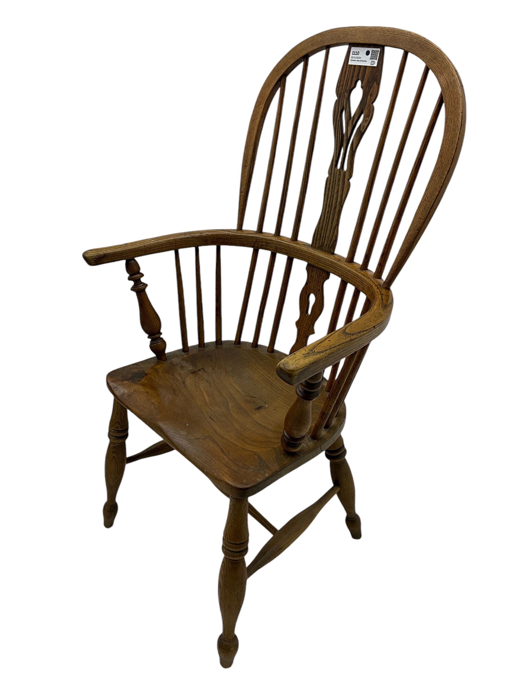 19th century elm and ash Windsor armchair, double hoop and stick back with shaped and pierced splat, on turned supports united by swell-turned H-stretchers (W60cm, H108cm); 19th century elm and yew wood Windsor chair (W57cm) (2)