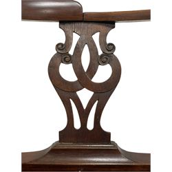 George III mahogany corner elbow chair, curved back rest and shaped arms with scroll carved terminals, on turned supports and pierced scroll carved interlaced splats, drop-in seat upholstered in brown leather, on square supports with inner chamfer and outer moulding 