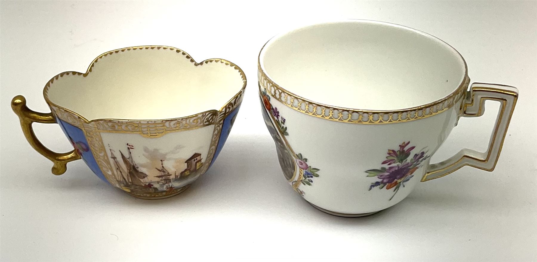 A 19th century Helena Wolfsohn Augustus Rex mark cup and saucer, of quatrefoil form, the cup painted with panels of flowers and waterside views, the saucer with flowers and courting couples, each heightened in gilt, each with painted mark beneath, cup H4.5cm, cup L13cm, together with a Continental cup and saucer, the cup painted with a panel of a figure with stargazing, the saucer with figures hunting, each further detailed with floral sprays and sprigs and heightened in gilt, each with painted blue crossed sword type mark beneath, cup H6cm, saucer L14cm. (2).  