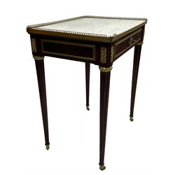 Late 19th century French figured plum pudding mahogany side table, canted rectangular white marble top with raised gilt metal gallery, fitted with a single frieze drawer, central extending floral cast ormolu escutcheon and applied moulded edging, on tapering turned and fluted supports with brass cups and castors, decorated with cast foliate mounts and foliate cast collars 