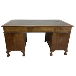 Georgian design twin pedestal desk, rectangular top with green leather inset, fitted with nine drawers, on cabriole supports with ball and claw feet 