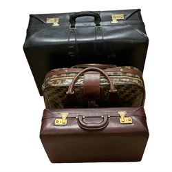 Two Jaeger suitcases, with combination locks together with another suitcase