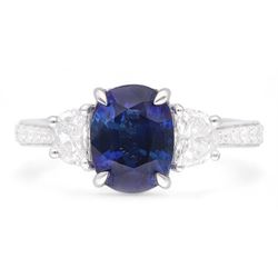 Platinum three stone oval cut sapphire and half moon cut diamond ring, with diamond set shoulders, hallmarked, sapphire 2.73 carat, total diamond weight approx 1.10 carat