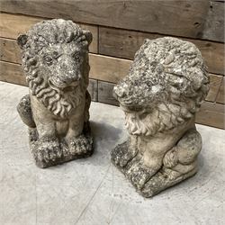 Pair of small weathered cast stone garden seated lions