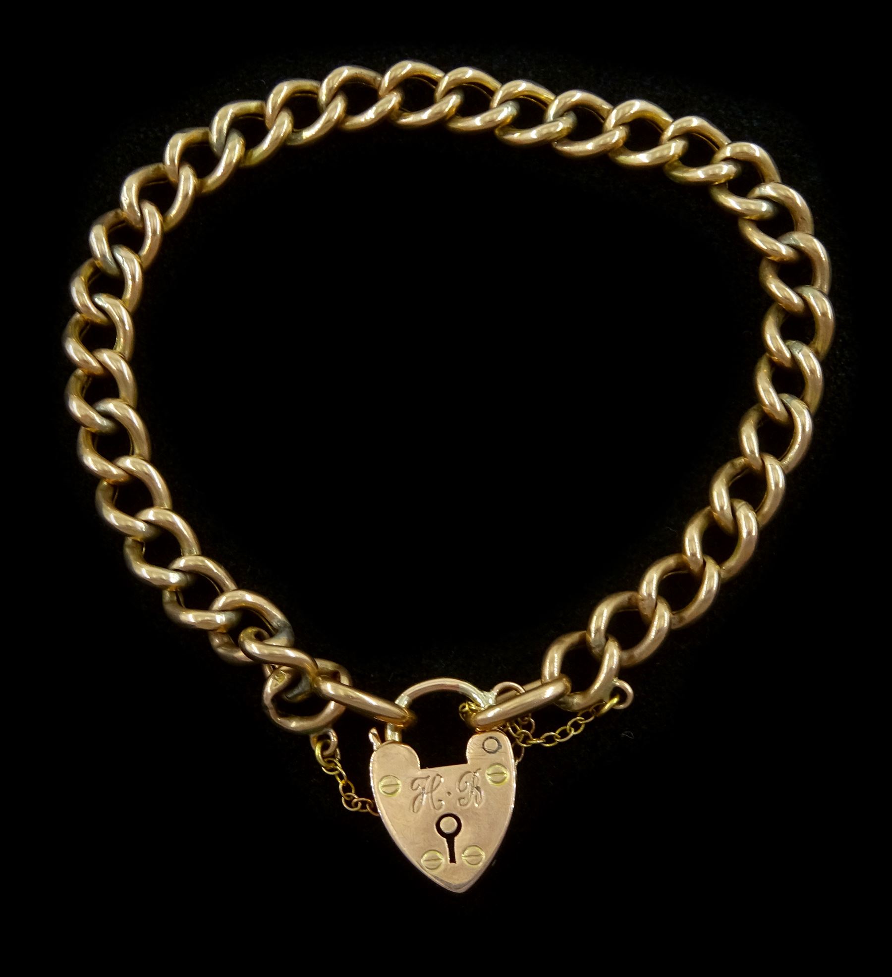 Early 20th century 9ct rose gold curb link bracelet, with heart locket clasp, stamped