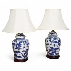 Pair of table lamps of baluster form, decorated with decorated with dragons chasing flamin...