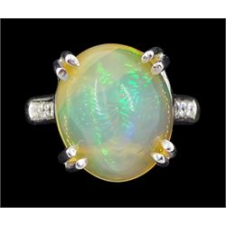 18ct white gold single stone opal ring, with round brilliant cut diamond shoulders, hallma...