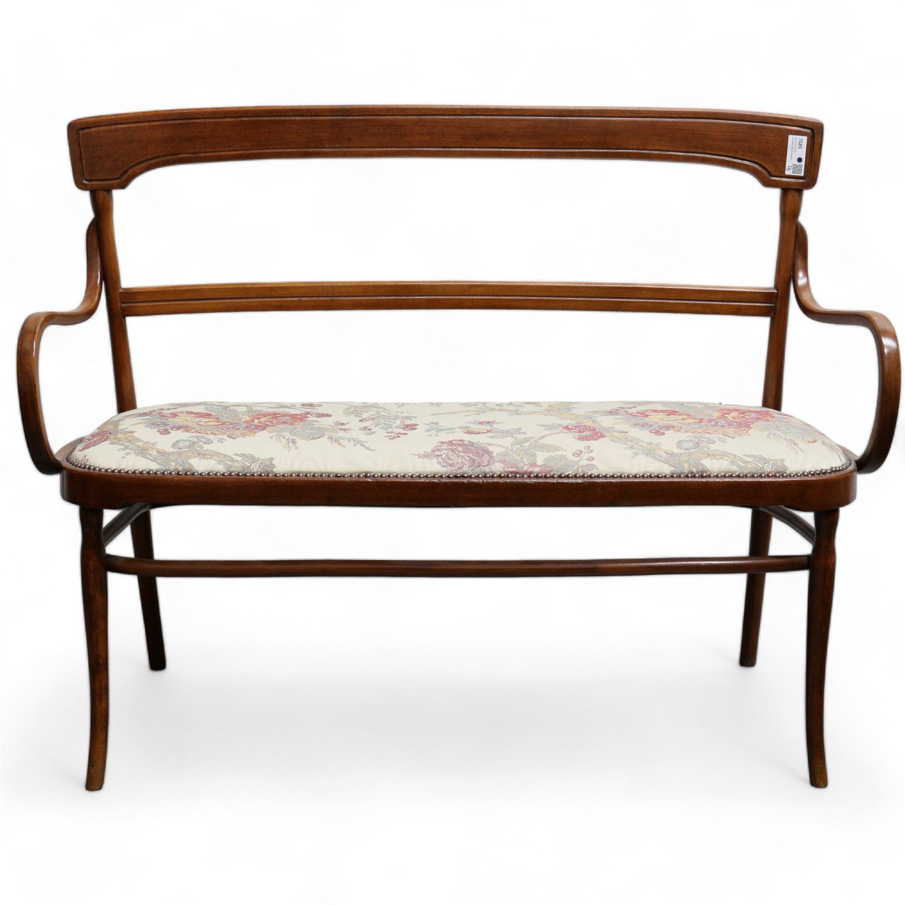 Early 20th century beech framed and bentwood bench, shaped cresting rail over rolled arms, upholstered seat in floral pattern fabric, on turned supports