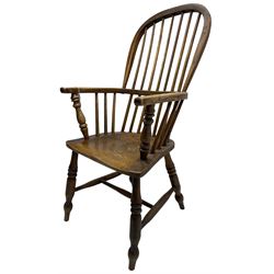 Early 19th century elm Windsor chair, high hoop and stick back over shaped saddle seat, raised on ring turned supports united by H-stretcher