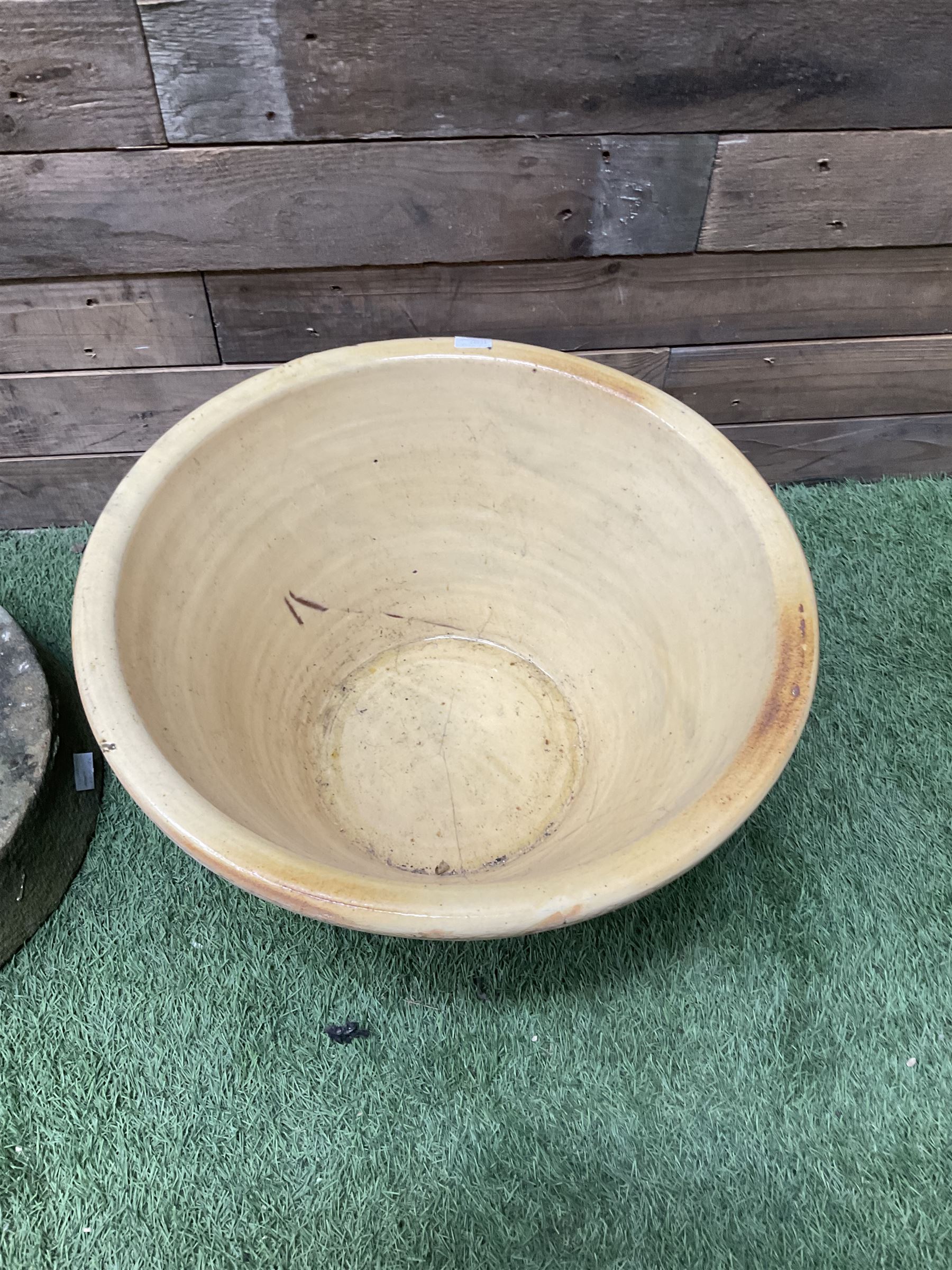 Pair of small stone mill stones and glazed pancheon  - THIS LOT IS TO BE COLLECTED BY APPOINTMENT FROM DUGGLEBY STORAGE, GREAT HILL, EASTFIELD, SCARBOROUGH, YO11 3TX