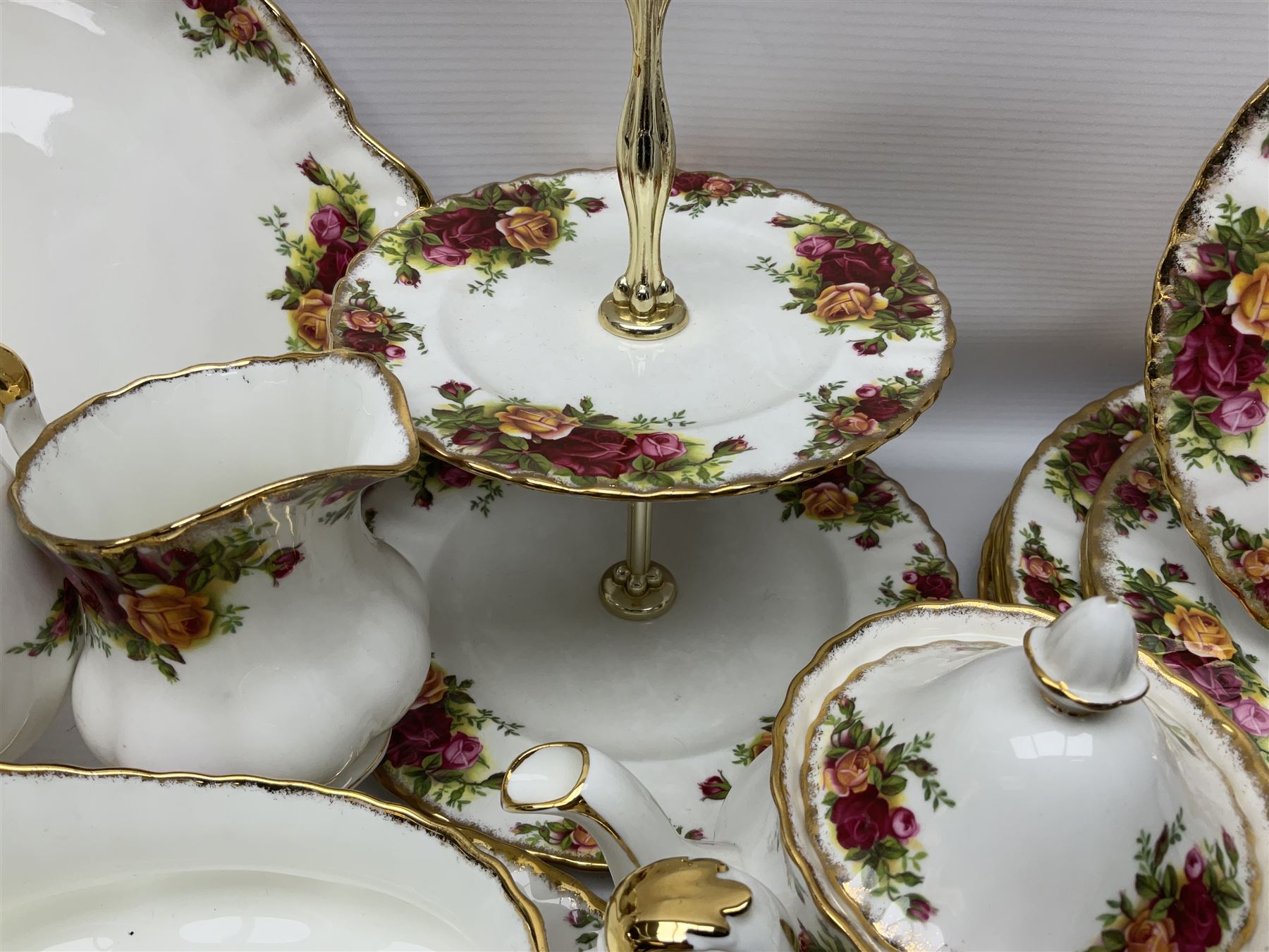 Royal Albert Old Country Roses pattern coffee service for six, comprising coffee pot, milk jug, cups and saucers, cake plate, together with miniature teapot, six teacups and saucers, six dinner plates, six side plates etc 