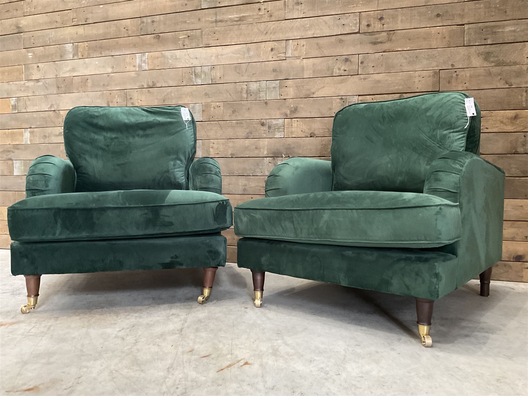 Pair of Howard design armchairs, upholstered in jade green velvet fabric