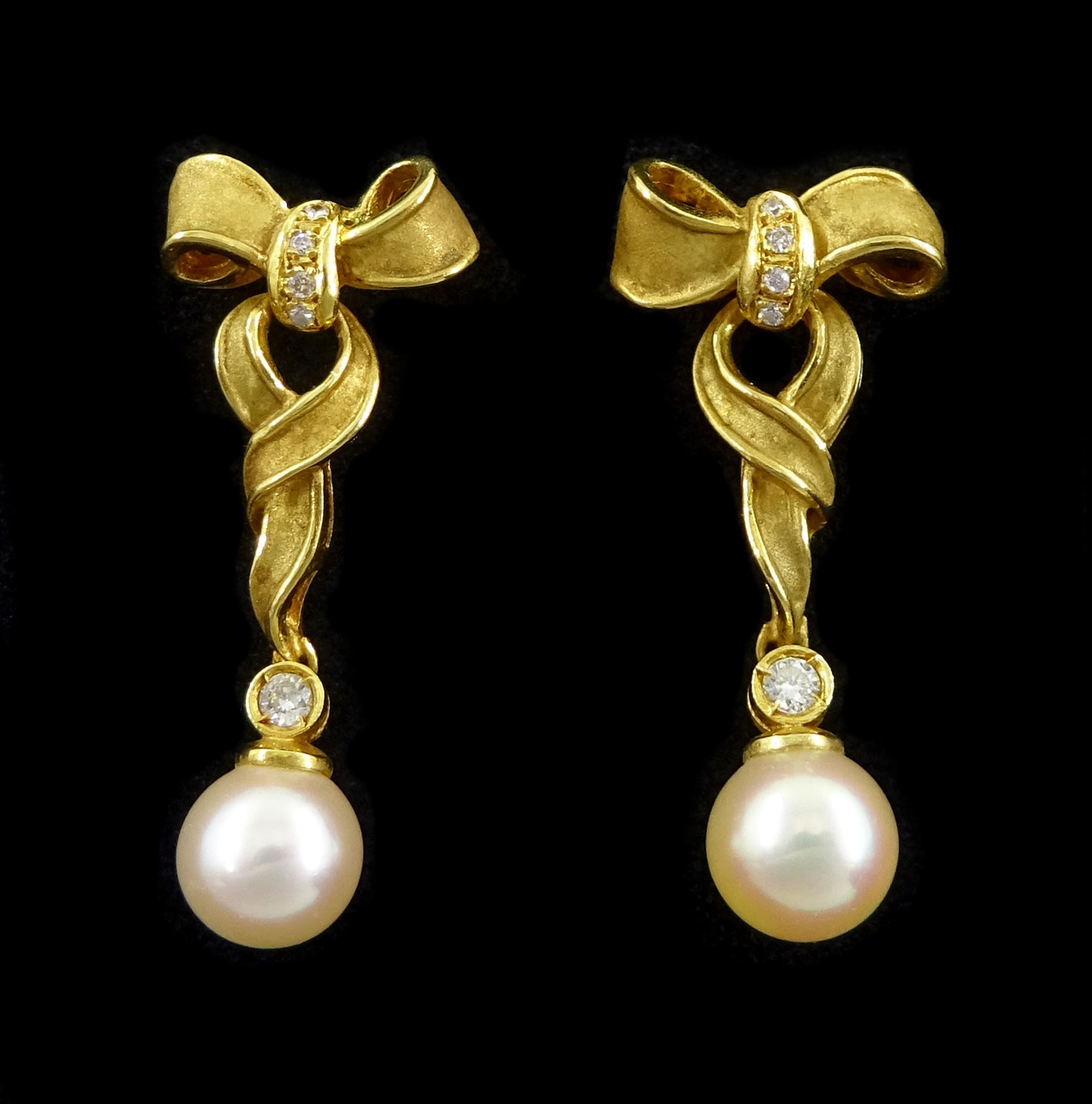 Pair of 18ct gold cultured cream / pink pearl and round brilliant cut diamond bow pendant stud earrings, London import mark 1992