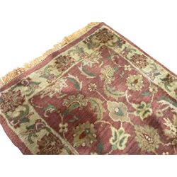 Persian Zeigler crimson ground runner rug, field decorated with scrolling foliate patterns with palmette motifs, enclosed by a camel guard band with further floral designs