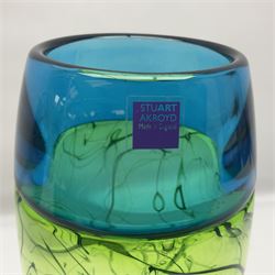 Stuart Akroyd glass vase, blue banded top and lime green lower section with free flowing line decoration, with sticker and engraved signature beneath, H29.5cm