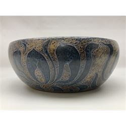 John Egerton (c1945-): studio pottery stoneware serving dish, decorated with abstract floral petals on a dark blue ground, D30cm