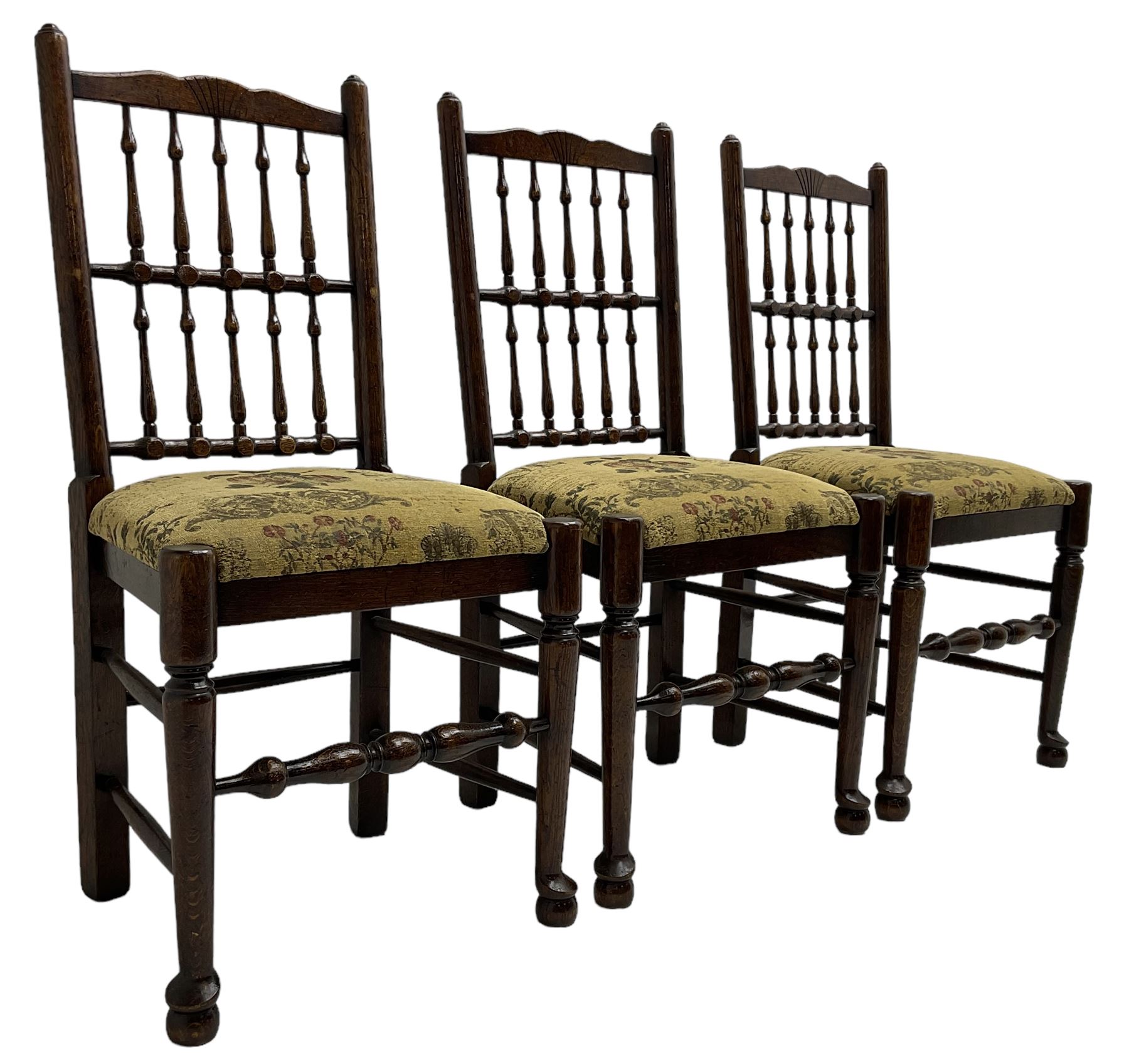 Set of six (4+2) 20th century oak spindle back dining chairs, with upholstered drop-on seat cushions, turned supports joined by turned stretchers