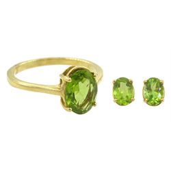 Gold single stone oval cut peridot ring and a similar pair of peridot earrings, both 18ct