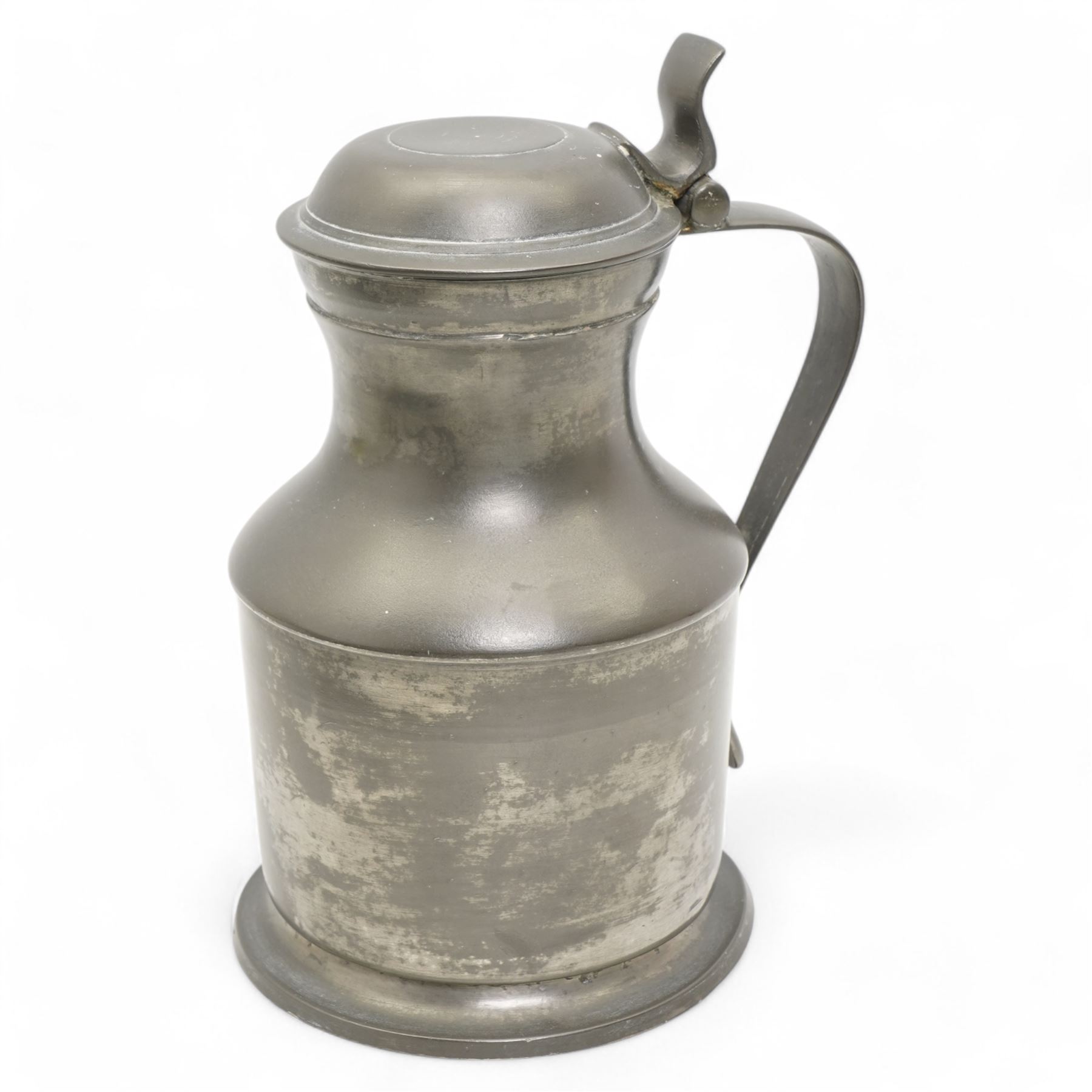 18th century pewter flagon, circa 1785, with domed tappit lid and trigger thumb piece, touch marks at the rim and base, H22cm