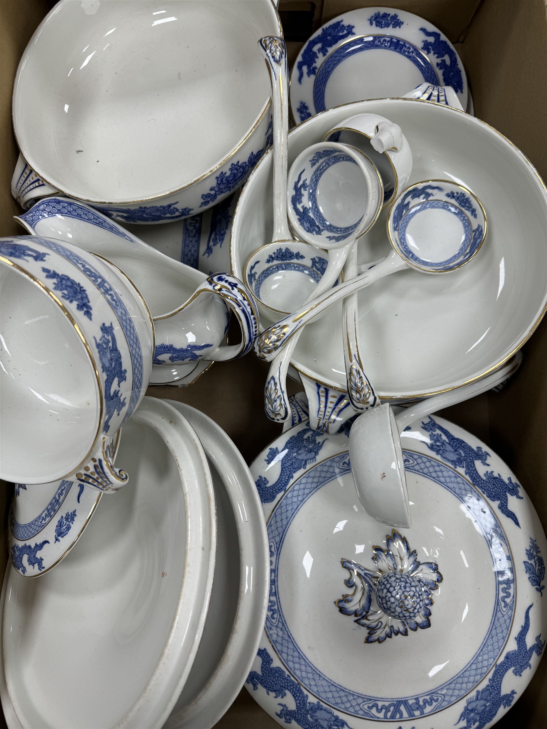 Extensive tea and dinner service of Booths and Cauldon dragon pattern, including, teapots, coffee pots, jugs, toast racks, bowls, dinner plates, platters, soup tureen etc 