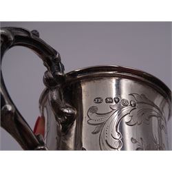 Victorian silver christening mug, of cylindrical form with fluted rim, gilt interior and acanthus capped C scroll handle, the body with later engraved decoration and initials, with embossed scroll base, hallmarked John Evans II, London 1840, including handle H10.2cm