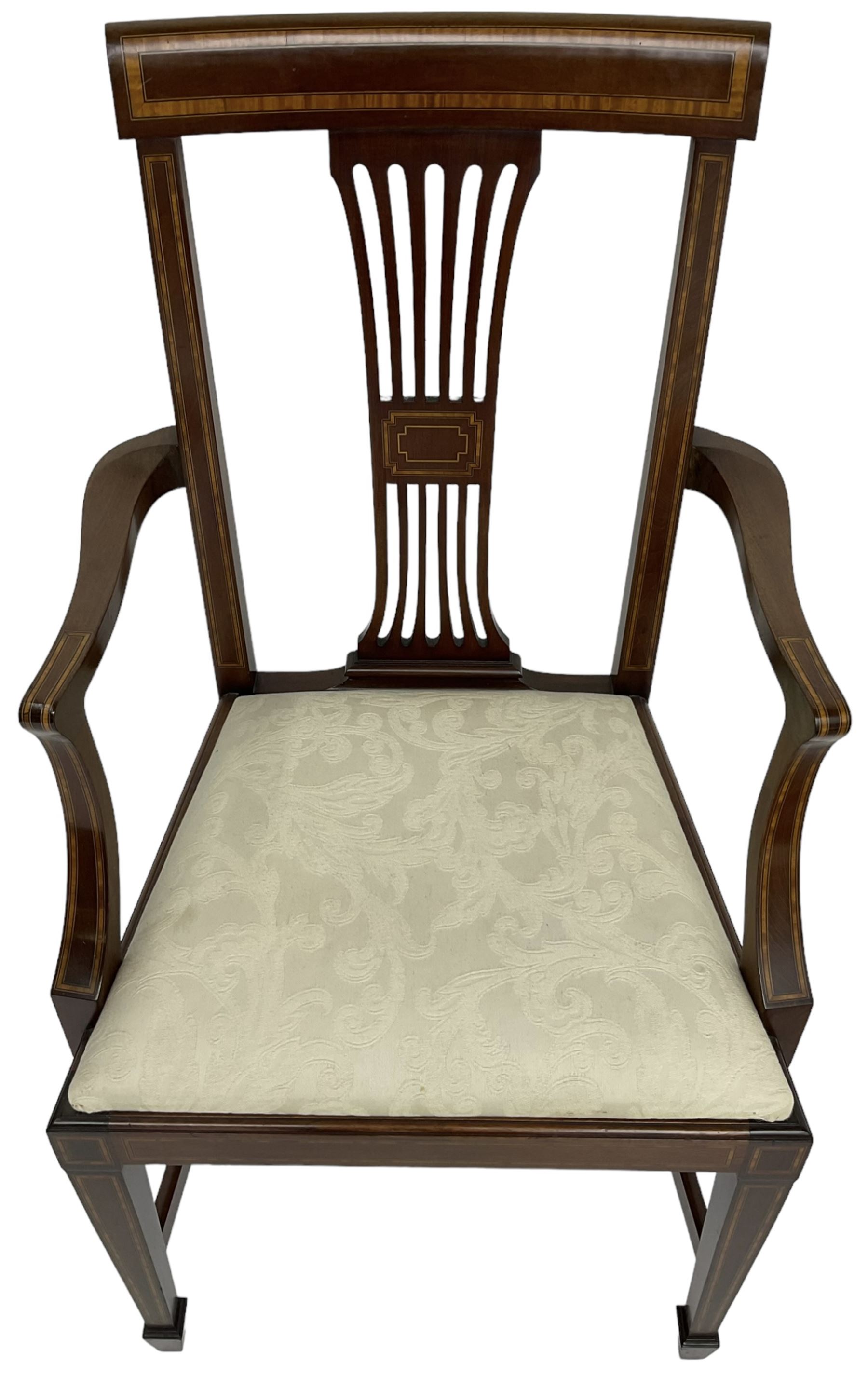 Set of four (2+2_ Edwardian inlaid mahogany dining chairs, cresting rail with satinwood banding, pierced splat backs with central inlay, drop-in seats upholstered in foliate patterned ivory fabric, raised on square tapering supports terminating in spade feet