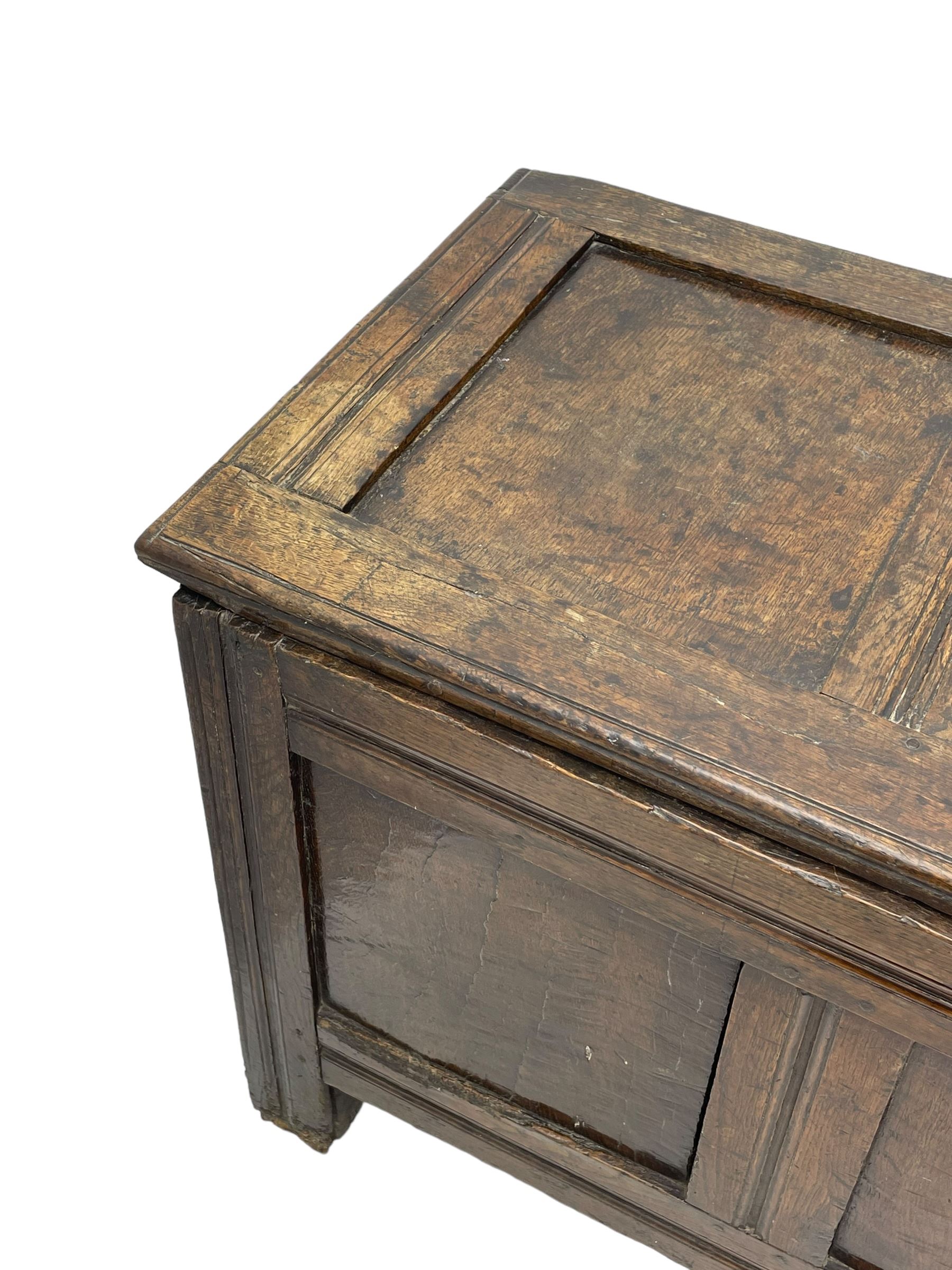 17th century panelled oak blanket chest or kist, quadruple panelled hinged lid over quadruple panelled front, moulded frame and pegged construction, on stile supports