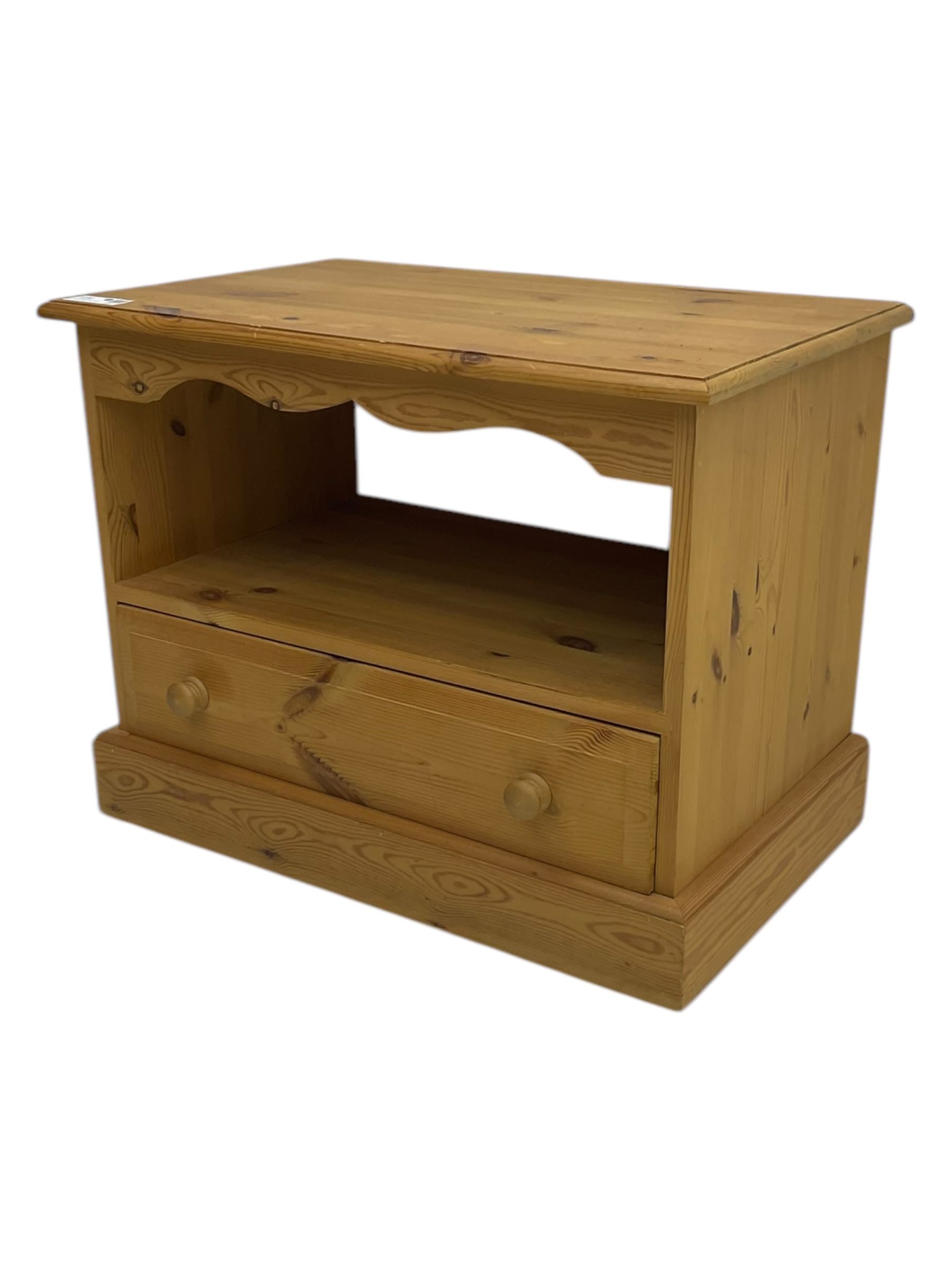 Pine television media unit, rectangular top with moulded edge, over open compartment and single drawer, on plinth base