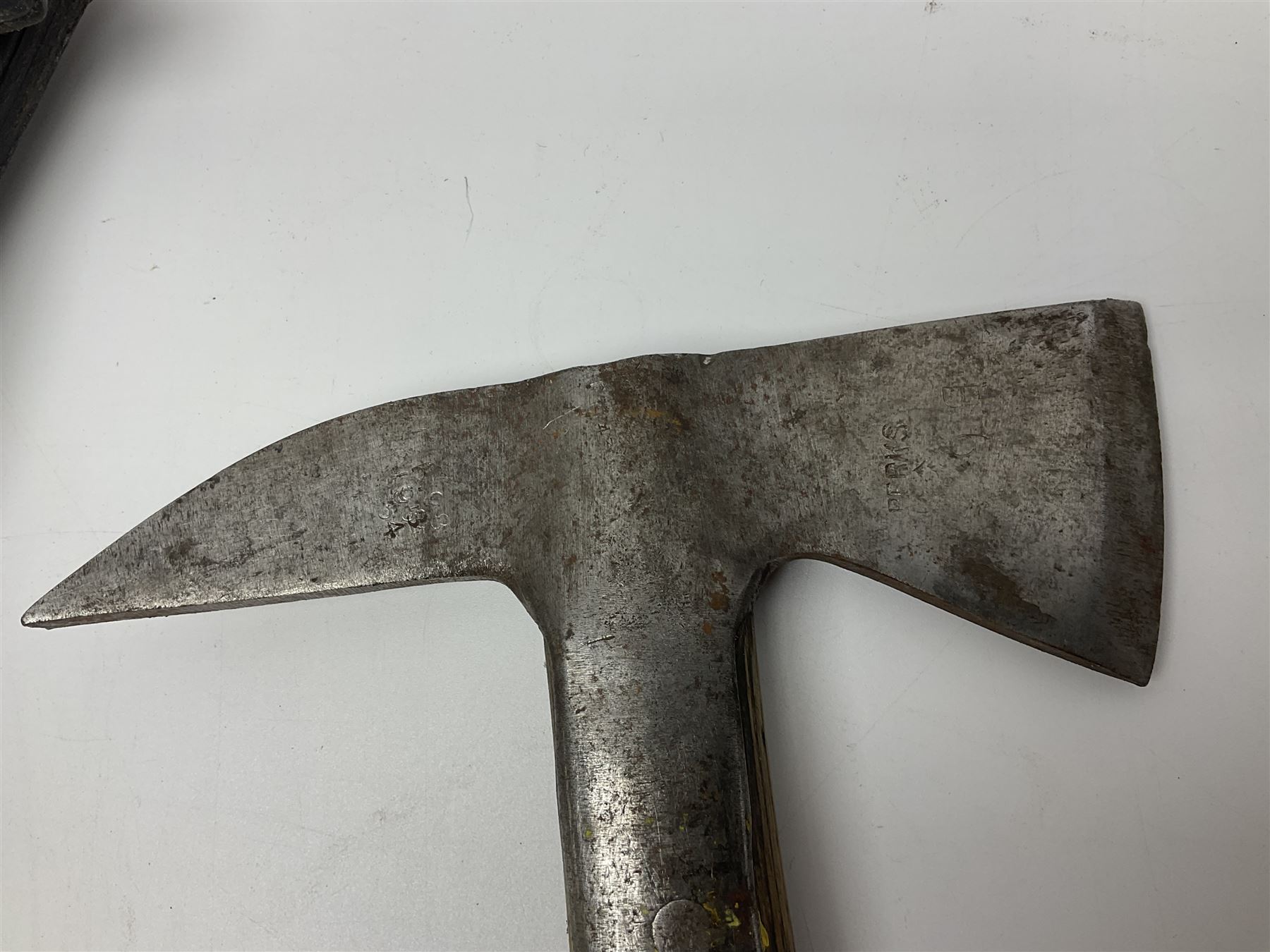 Post-War military type fireman's axe impressed 'PERKS 1953/54' with additional indistinct mark probably WD arrow, ash handle L39cm; and another stonemason's(?) double headed axe with mallet shaped shaft (2)