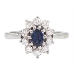 18ct white gold oval cut sapphire and round brilliant cut diamond cluster ring, London 1973, sapphire approx 0.50 carat, total diamond weight approx 0.30 carat 