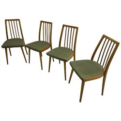 Set of four mid-20th century beech framed dining chairs, vertical slat back over upholstered seats, on tapering supports