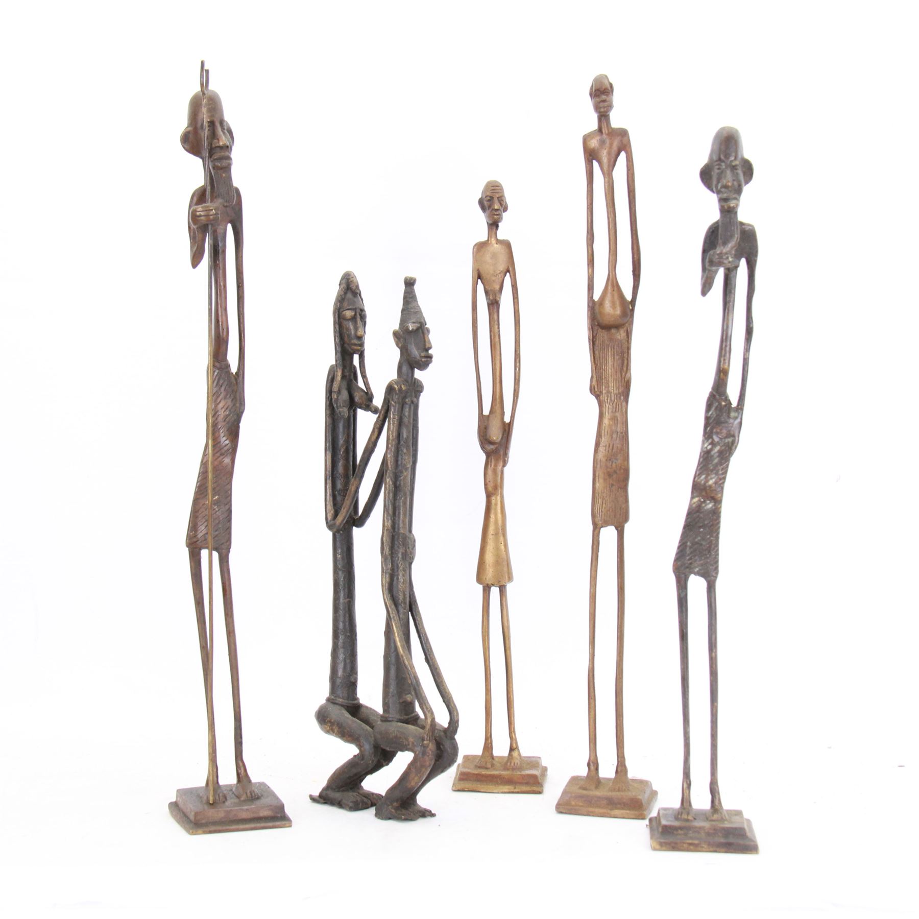 Five bronzed tribal figures, of elongated form, tallest H18cm